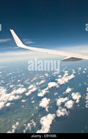 Aerial view from aeroplane of aircraft wing and clouds over Queensland ; Australia Stock Photo