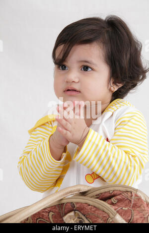 Fifteen month old baby girl clapping MR#743S Stock Photo
