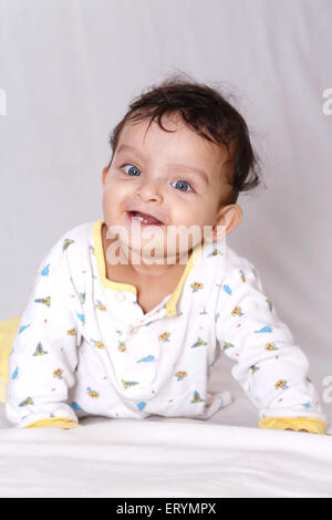 Baby boy on his stomach trying to crawl MR#743W Stock Photo