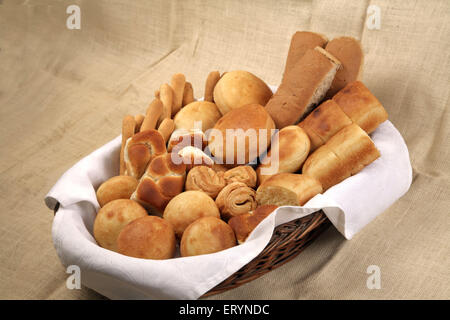 Different types of breads in cane basket India PR#743AH Stock Photo