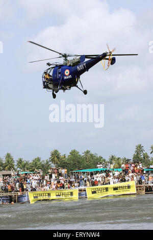 Indian navy chetak helicopter hovers at punnamada lake ; Alleppey ; Alappuzha ; Kerala ; India Stock Photo