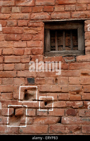 Bullet marks visible on preserved wall at Jallianwala or Jalianwala Bagh ; Amritsar ; Punjab ; India Stock Photo
