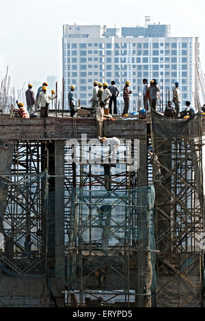 Construction workers working on skyscraper building , Bombay ,  Mumbai , Maharashtra , India , Asia Stock Photo