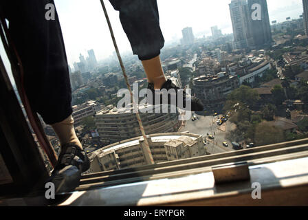 Construction worker working on skyscraper building , Bombay ,  Mumbai , Maharashtra , India , Asia Stock Photo