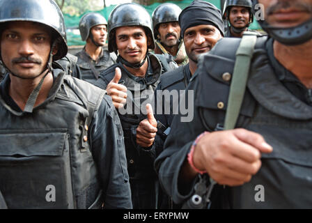 National Security Guard NSG commandos showing thumps sign after terrorist attack by deccan mujahedeen ; Bombay Stock Photo