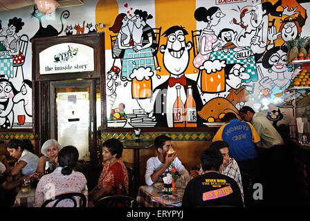 Cafe Mondegar , Indian cartoonist and painter Mario Miranda painted murals cartoons , Colaba , Bombay , Mumbai , Maharashtra , India , Asia Stock Photo