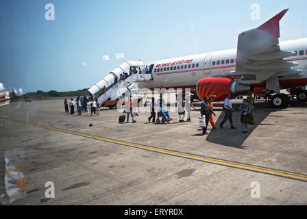 Passengers alighting from Air India flight at Sahar or Chhatrapati Shivaji domestic airport Bombay Mumbai Maharashtra India Asia Stock Photo