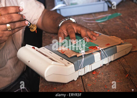 Sealing electronic voting machine , Bombay , Mumbai ; Maharashtra , India , Indian elections , Asia Stock Photo