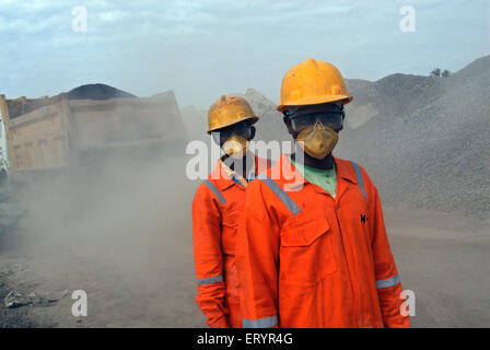 Workers wearing masks for protection ; Madras ; Chennai ; Tamil Nadu ; India ; Asia Stock Photo