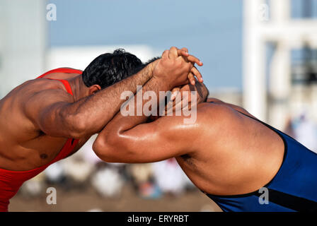 Indian wrestling , pehlwani , kushti , kushtee , koshti , pahlevani , malla yuddha , wrestlers , wrestling match , Nanded , Maharashtra , India , Asia Stock Photo