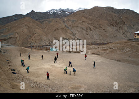 Boys playing cricket ; Wakha Wado village ; Kargil ; Leh ; Ladakh ; Jammu and Kashmir ; India 9 April 2008 Stock Photo
