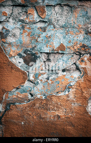 Background of colorful brick wall texture. brickwork. Peeling paint. Pattern of rustic grunge material. Stock Photo