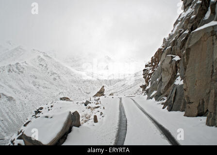 Snow covered Khardungla mountain pass road , Khardung La , Khardong La , Khardzong La , Leh , Ladakh , Jammu and Kashmir , India , Asia Stock Photo