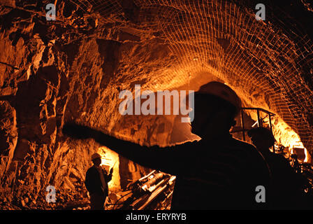 Engineer workers working inspecting checking tunnel of hydroelectric project ; Uri ; Jammu and Kashmir ; India ; Asia Stock Photo