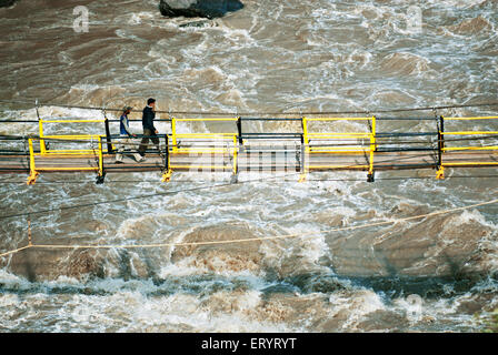 People crossing bridge , Jhelum river , Uri , Baramulla , Jammu and Kashmir , India , Asia