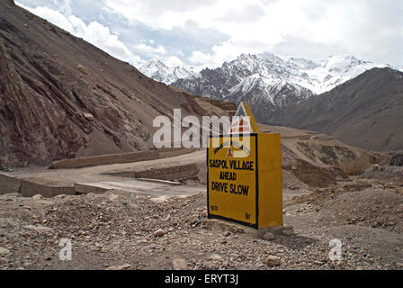 Saspol village and drive slow signboard at leh kargil road and Himalayan mountain ; Ladakh ; Jammu and Kashmir Stock Photo