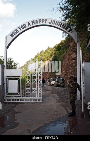 Happy journey on entry gate guarded by bsf soldier at Kamanpost ; Uri ; Jammu and Kashmir ; India 6 April 2008 Stock Photo