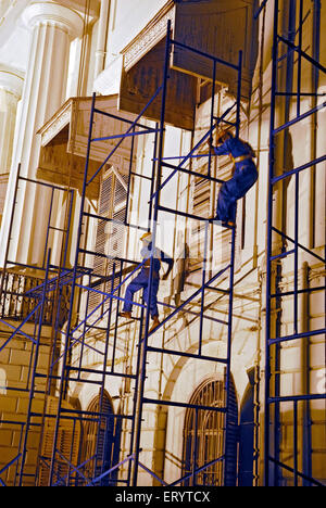 Workers working on Town Hall Bombay Mumbai ; Maharashtra ; India Stock Photo