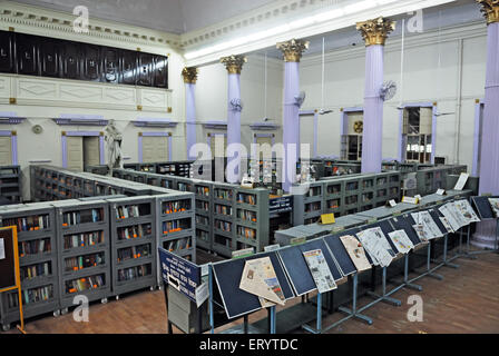 Newspaper stand and book shelves in town hall asiatic library Bombay Mumbai ; Maharashtra ; India Stock Photo