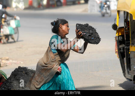 Women cleaning sewage, manual scavenging, Bombay, Mumbai,  Maharashtra, India, Asia, Indian, Asian, manually cleaning, carrying, disposing sewage Stock Photo