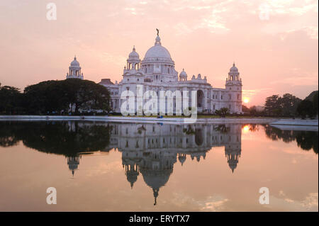 Victoria Memorial reflection in water at sunset , Calcutta , Kolkata , West Bengal , India Stock Photo