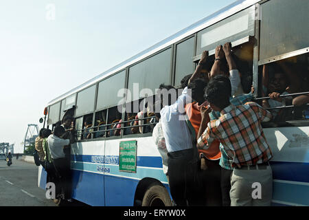 Overcrowding in public bus service , Metropolitan Transport Corporation , MTC , PTC , Madras , Chennai , Tamil Nadu , India , Asia Stock Photo