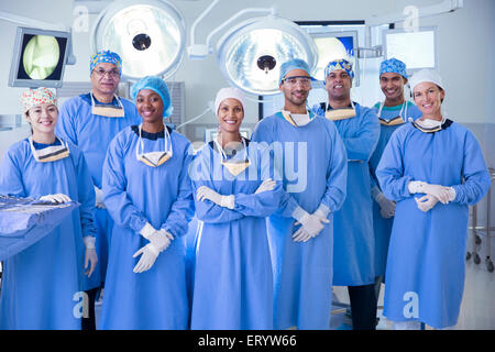 Portrait of confident team of surgeons in operating room Stock Photo