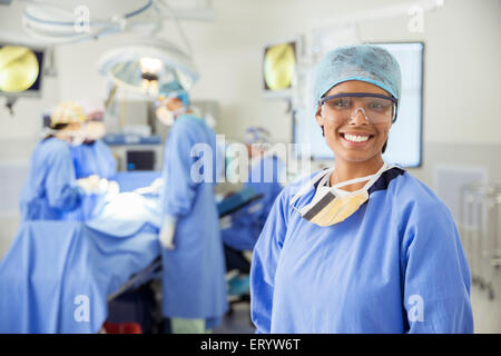 Portrait of smiling surgeon in operating room Stock Photo