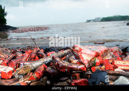 Oil soaked biscuit packets floating due to container ship chitra colliding in sea Bombay Mumbai ; Maharashtra Stock Photo