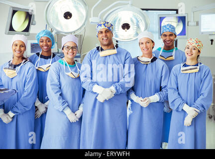 Portrait of confident surgeons in operating room Stock Photo