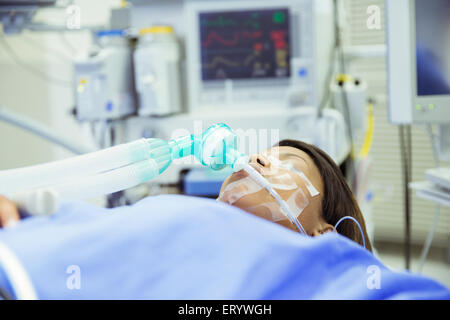 Patient with oxygen mask in operating room Stock Photo