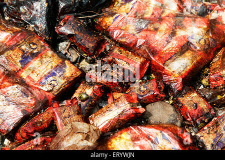 Oil soaked biscuit packets due to container ship chitra colliding in sea Bombay Mumbai ; Maharashtra ; India Stock Photo