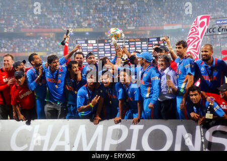 Cricketers celebrate trophy beating Sri Lanka ICC Cricket World Cup 2011 final match Wankhede Stadium Mumbai India Stock Photo