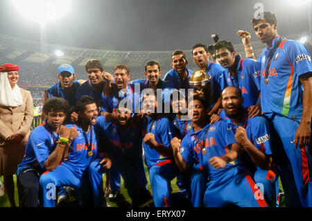 Cricketers celebrate trophy beating Sri Lanka ICC Cricket World Cup 2011 final match Wankhede Stadium Mumbai india - Stock Photo