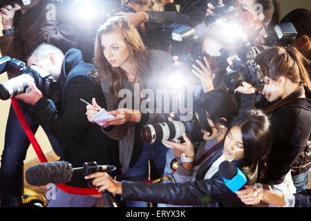 High angle view of paparazzi photographers and reporters at event Stock Photo