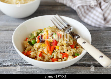 quinoa with slices of vegetables in bowl, healthy food Stock Photo