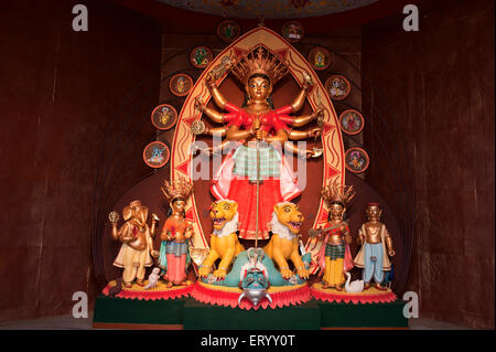 Goddess durga killing demon mahishasura with goddesses laxmi saraswati and gods ganesh kartik at kolkata ; Calcutta ; India Stock Photo