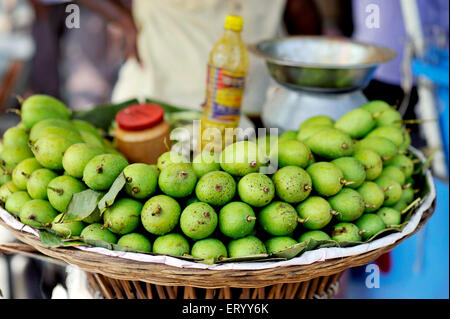 Green mango snack, Sunday Market, Baghbazar, Calcutta, Kolkata, West Bengal, India, Asia Stock Photo