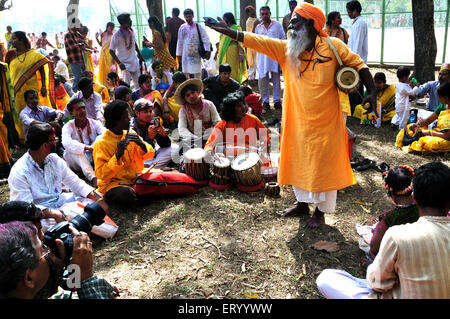 Baul folk singer singing folk songs ; Shantiniketan ; Calcutta ; Kolkata ; West Bengal ; India ; Asia Stock Photo