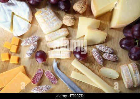 cheeseboard with grapes and mold salami Stock Photo