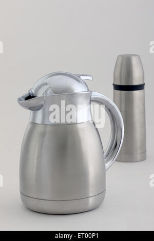 Stainless steel jug and thermos flask on white background Stock Photo
