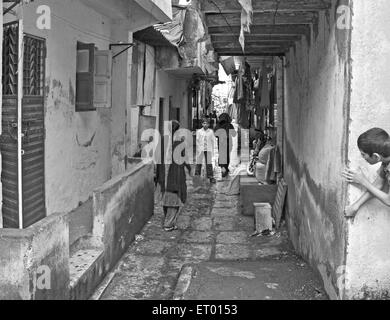 Narrow lane in Bhatwadi and Devnar slum ; Bombay Mumbai ; Maharashtra ; India Stock Photo