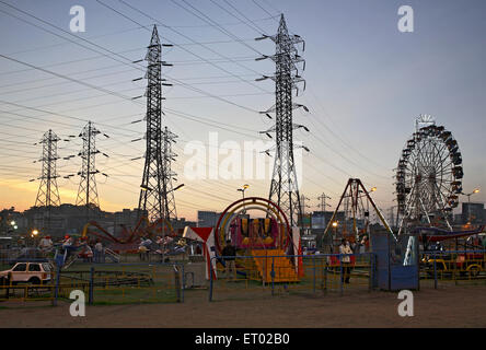 Ferris Wheel, Giant Wheel, amusement ride, electricity transmission tower, India, Asia Stock Photo