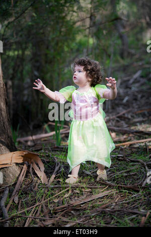 little girl in forest dressed as a fairy with soap bubbles Stock Photo ...