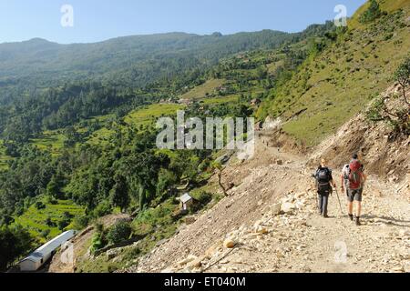 Trekking couple , Ghode Pani , Ghorapani , Ghorepani , Ghoripani , Shikha , Ulleri , Nepal , Federal Democratic Republic of Nepal , South Asia , Asia Stock Photo