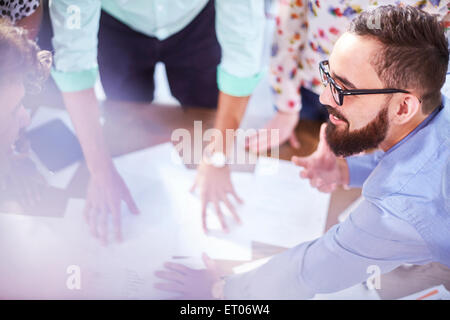 Creative businessman leading meeting Stock Photo