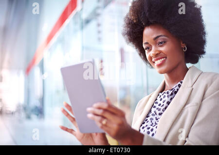 Smiling businesswoman using digital tablet Stock Photo