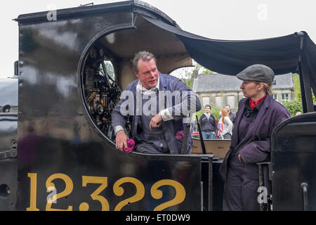 Steam locomotive driver and fire person on the footplate of the steam locomotive Stock Photo