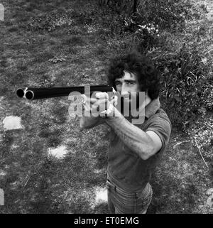 Charlton Athletic footballer Derek Hales poses with his