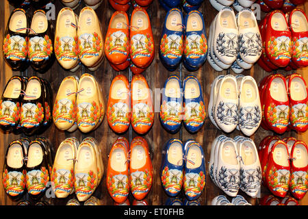 Dutch wooden shoes (clogs) on wall display Stock Photo